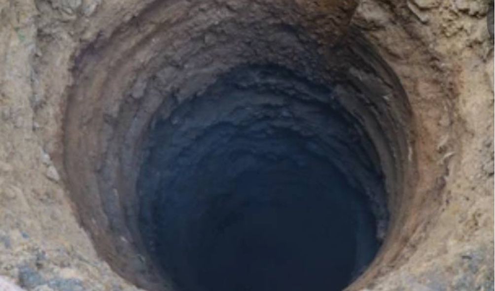 Shock as the body of a missing Head Teacher found inside a borehole at his home