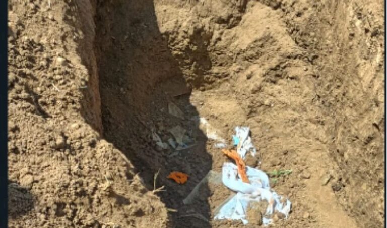 Villagers in shock after grave is vandalised twice parts of 'exhumed' coffin are dumped by the roadside