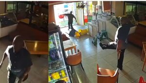 Chaos as MCA is caught on CCTV wielding a knife at customers and staff at a restaurant
