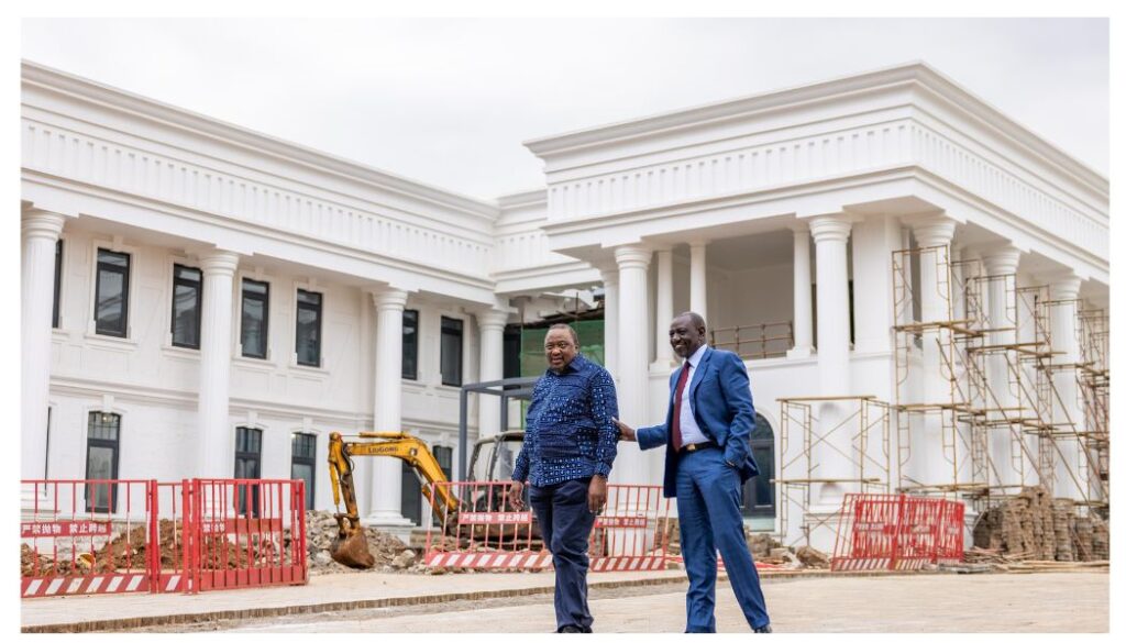 Retired President Uhuru Kenyatta share light moment with President William Ruto at State House Nairobi.