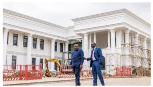 Retired President Uhuru Kenyatta share light moment with President William Ruto at State House Nairobi.