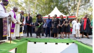 mourners storm Raila’s grave, destroy wreaths moments after burial